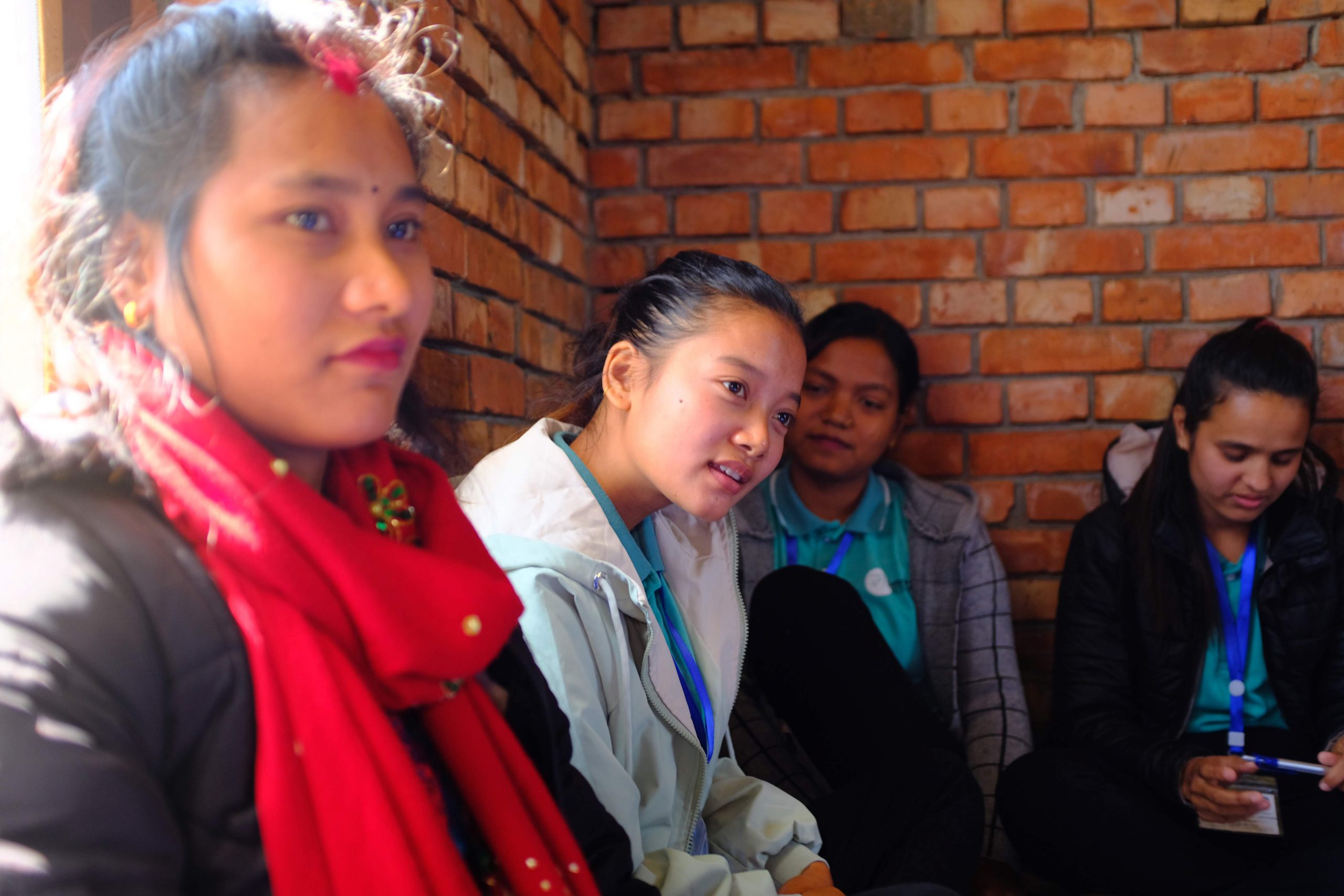 Peace Ambassador Shiva shares her experience in community peacebuilding during a meeting with founder Rita Thapa.