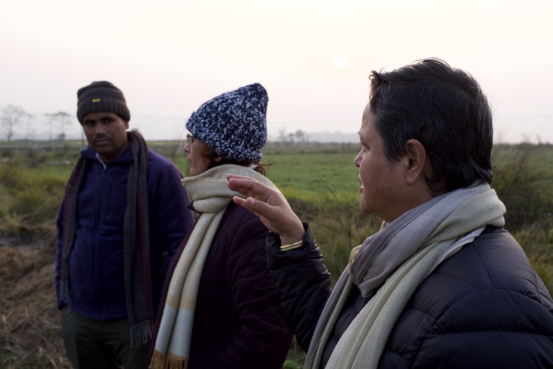 Rita Thapa and Susan Risal in conversation with District Program Officer Mr. Govinda Prasad Acharya during the site inspection.