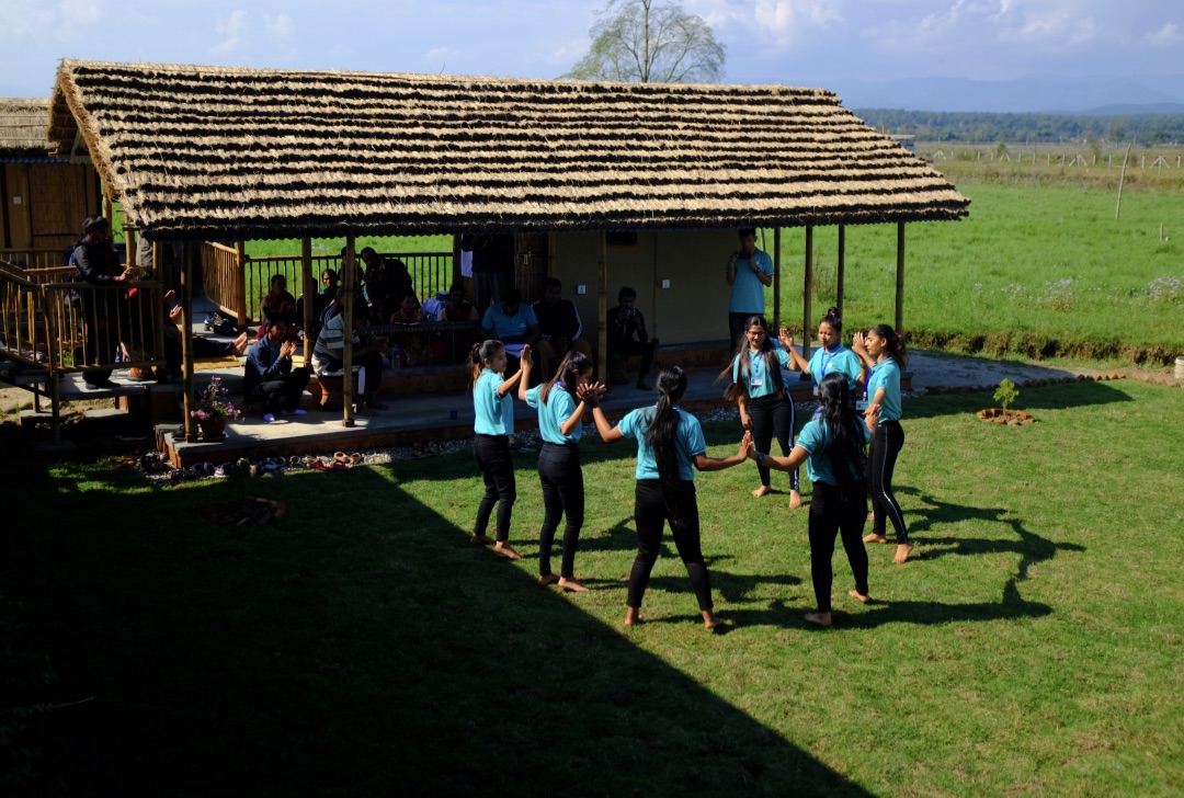 Youth peace leaders perform a dance for the community.